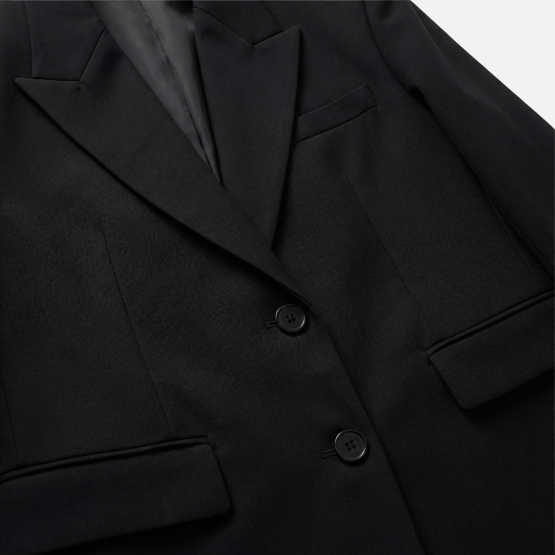 Blazer oversize in tessuto a trama con tasche frontali da donna