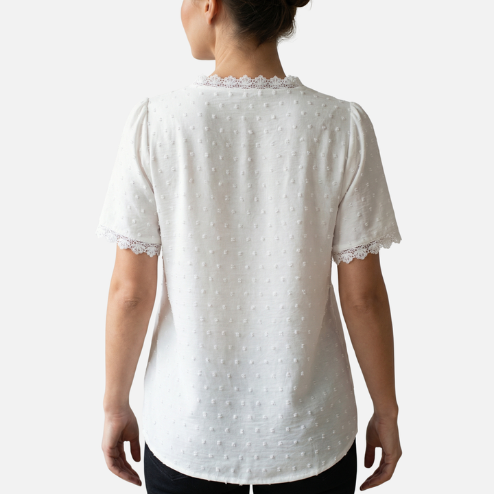 Blusa con scollo a V, pizzo e pois in rilievo da donna